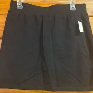 Black skirt by T Talbots. 18 1/2”.  Zipper pocket on each side of front.